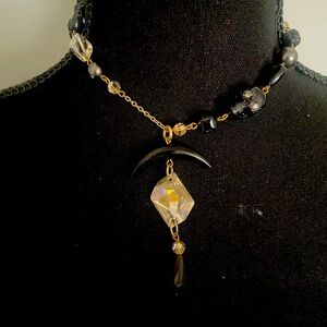 Scull and rose necklace with reflective pendant